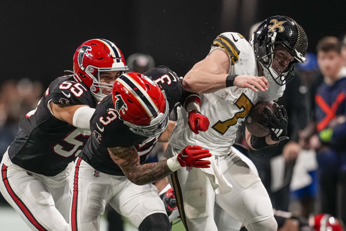 Nov 26, 2023; Atlanta, Georgia, USA; Atlanta Falcons safety Jessie Bates III (3) and LB Kaden Elliss (55) knock Taysom Hill (7) of the New Orleans Saints out of bounds. Mandatory Credit: Dale Zanine-USA TODAY Sports